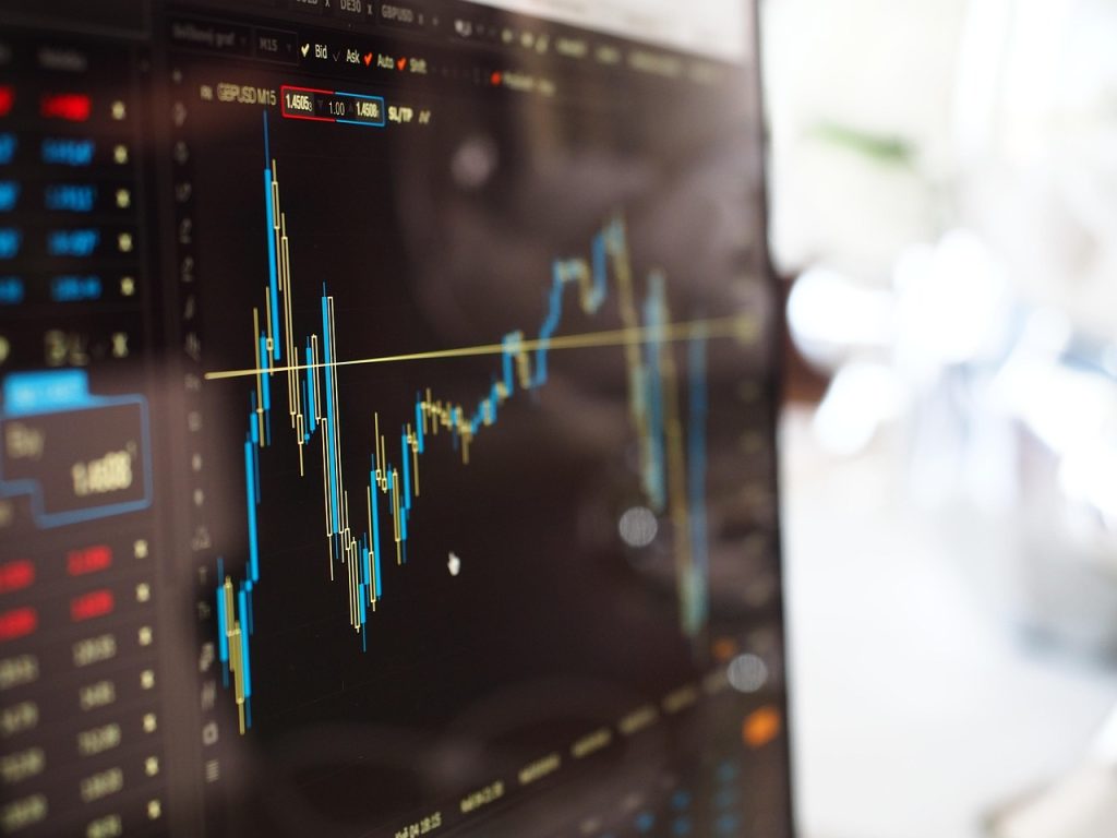 A stock chart climbing on a trading screen