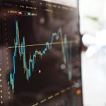 A stock chart climbing on a trading screen