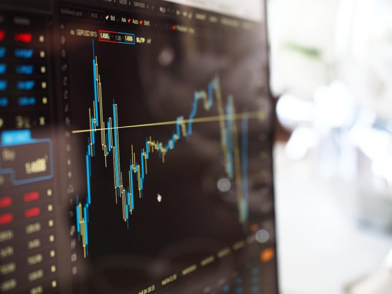 A stock chart climbing on a trading screen