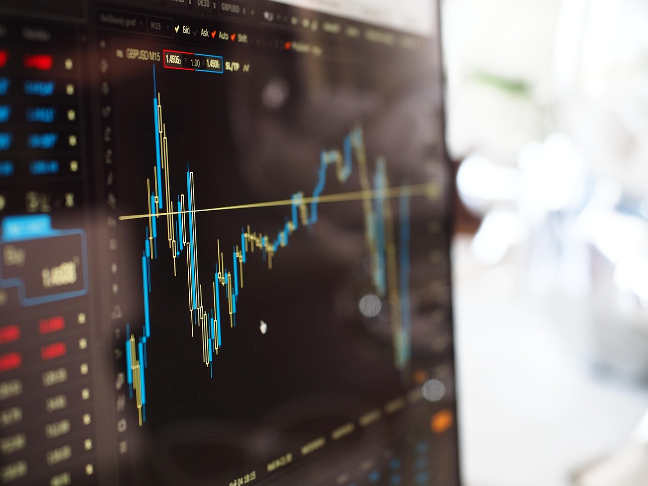 A stock chart climbing on a trading screen